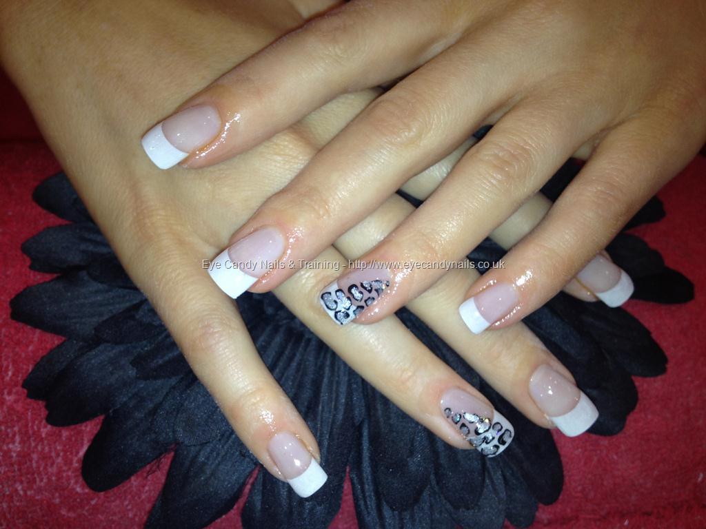 Acrylic nails with white tips and leopard print on ring finger as nail 