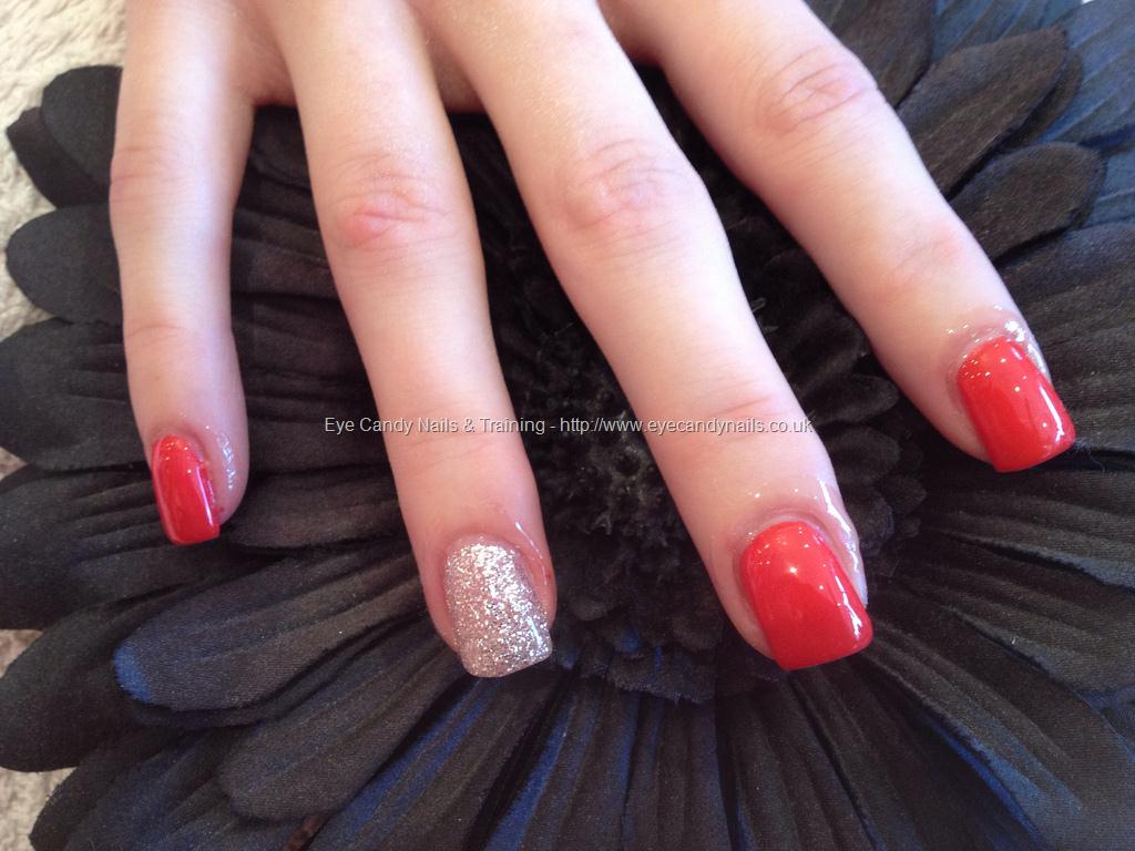 Acrylic nails with red polish and glitter on ring finger #NailArt # ...