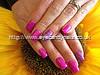 Acrylic nails with pink gel polish with glitter