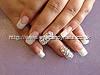 Full set of acrylic nails with Swarovski crystals on ring finger