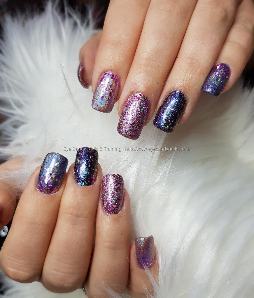 Aurora pigment and Swarovski crystals sculpted gel stiletto nails